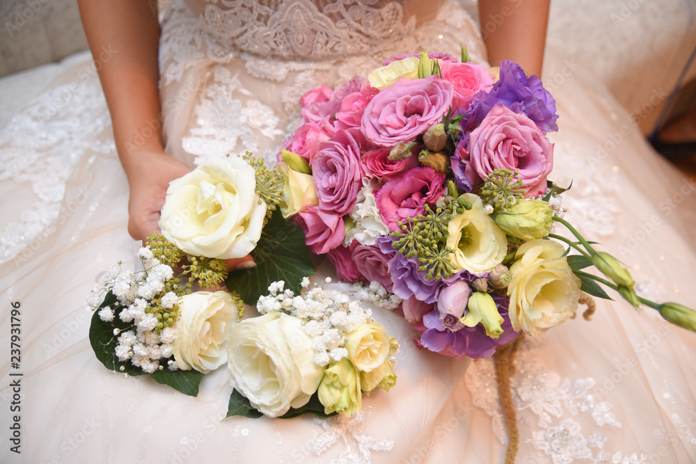 The bride with a bouquet. Comrade bride ready for hr best day. Beautiful wedding bouquet. The bride with a bouquet. Comrade bride ready for hr best day. Beautiful wedding bouquet.