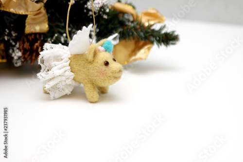 Yellow flying wool pig on tree New year 2019