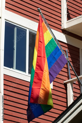 Rainbow Pride flags in front of a home
