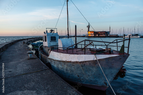 Fishing boats near the pier in the port of Nida. Lithuania.