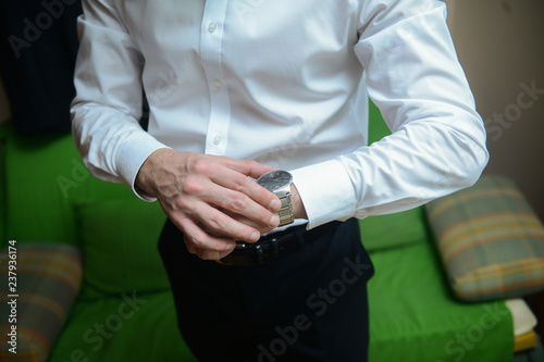 A businessman in a suit. A businessman is preparing to meet with clients.