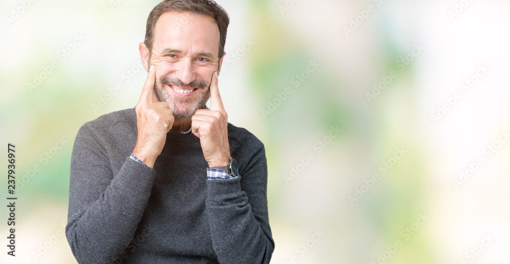 Handsome middle age senior man wearing a sweater over isolated background Smiling with open mouth, fingers pointing and forcing cheerful smile Handsome middle age senior man wearing a sweater over isolated background Smiling with open mouth, fingers pointing and forcing cheerful smile