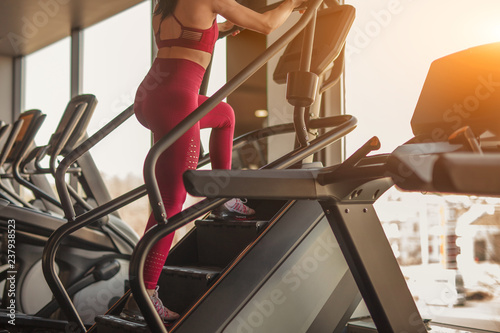Woman training on stepper in gym