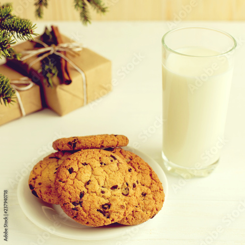 Milk and cookies for Santa Claus under the christmas tree. Concept  copy Space.