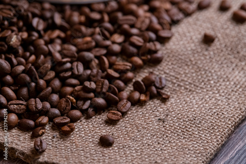 Coffee beans layed on a sack cloth - a close up phote