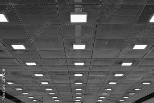 Ceiling with neon lights in aiport. Abstract empty interior space .