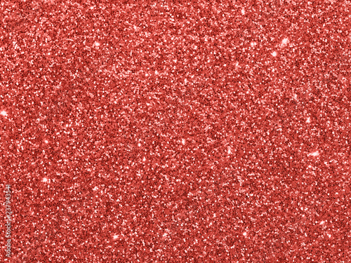 Sparkling background made of Living Coral 2019 lights. Festive blurred backdrop for holidays and parties. Top view or flat lay. Copy sace for text