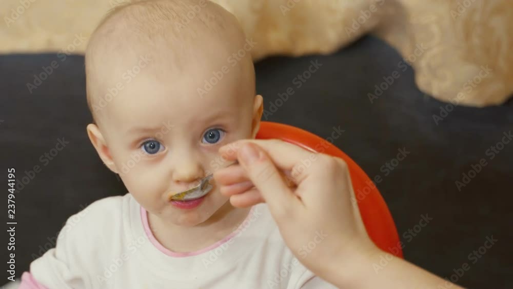 Baby Girl Eating Puree at Home Baby Girl Eating Puree at Home