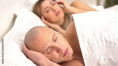 Difficulties in the relationship of men and women, a young couple is worried about relationships, insincere sex, in bed make love, sexual relations between a pumped man and a young woman