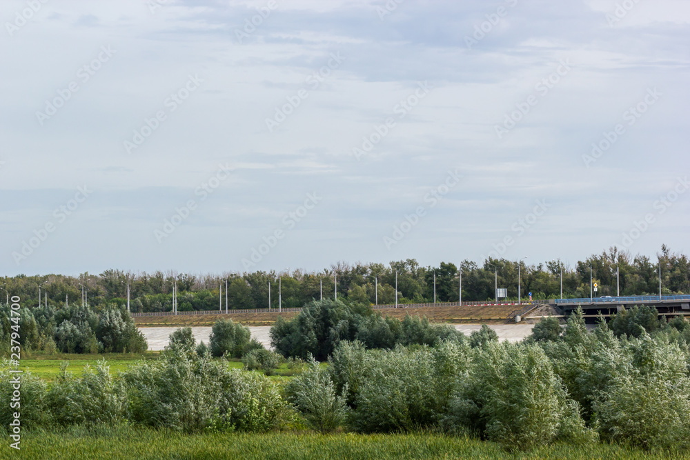 Road bridge passing through the field