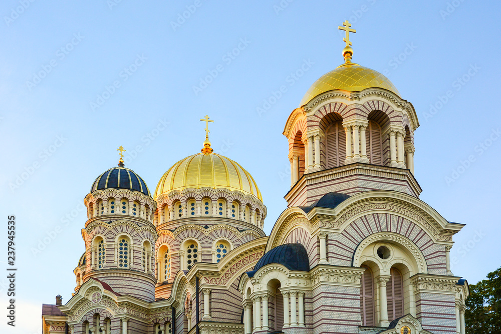 Religious building, Orthodox Christian cathedral with golden domes. Riga Nativity of Christ Cathedral.