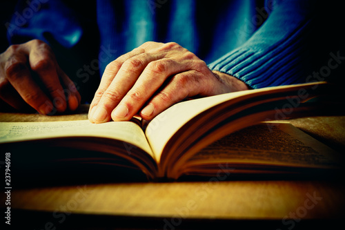 Hands and book