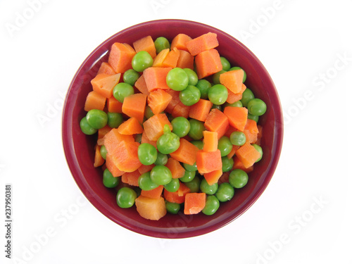 peas and carrots in a bowl isolated on white