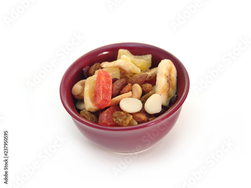 Dried fruit in a bowl isolated on white