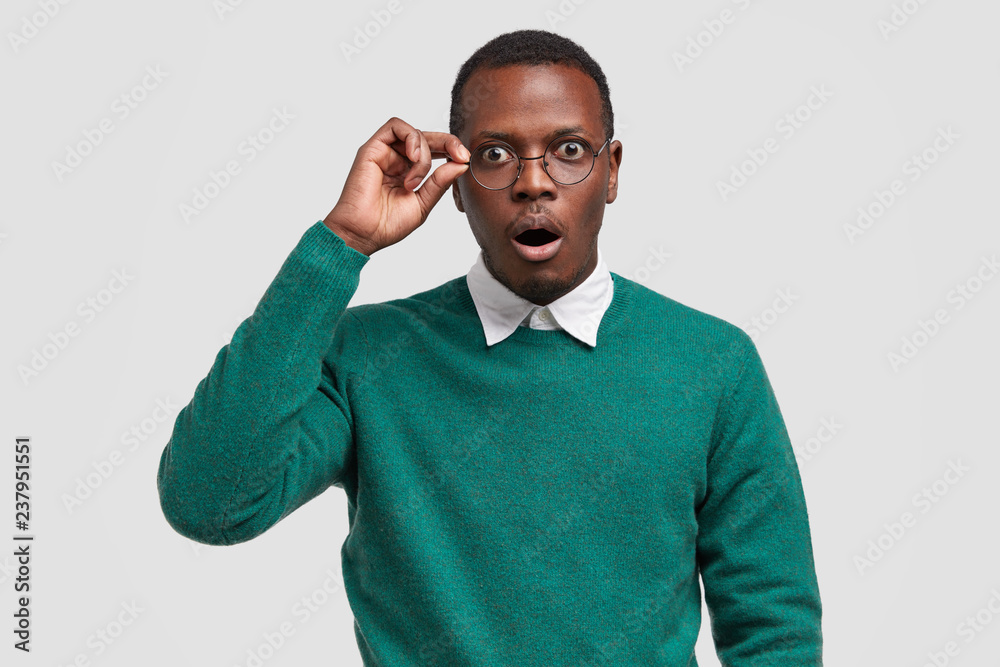 Surprised dark skinned male teacher 
