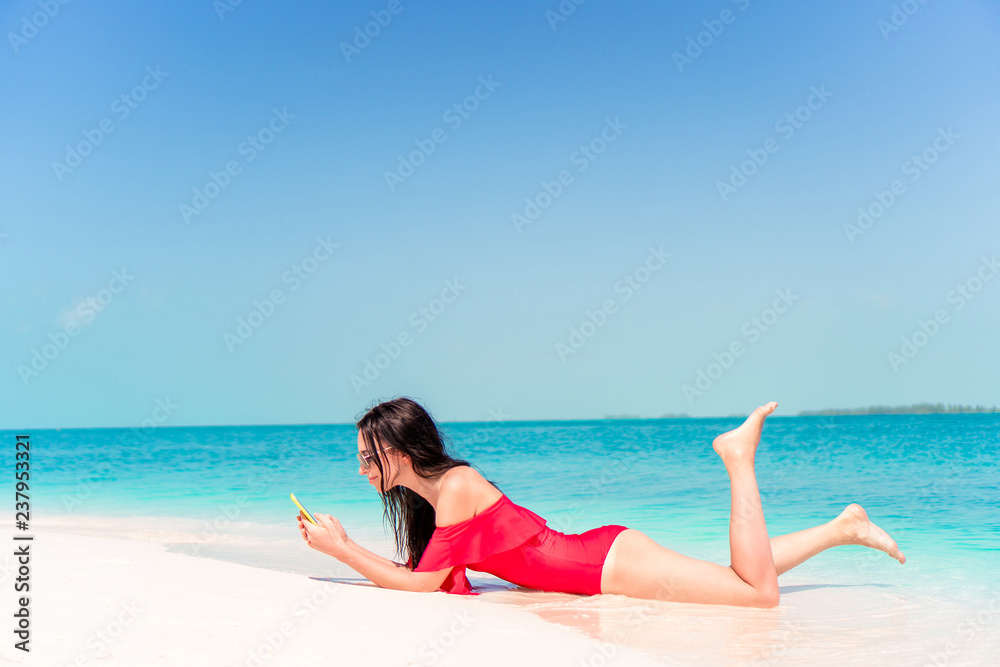 Young woman on a tropical beach with hat Young woman on a tropical beach with hat
