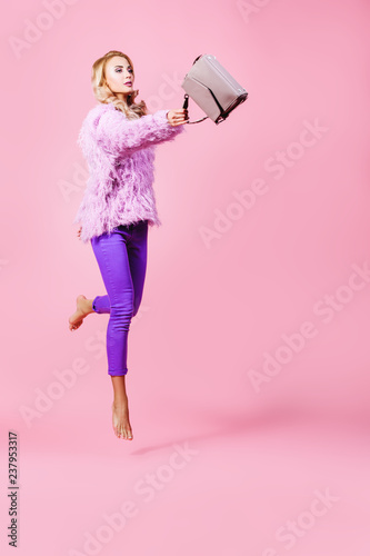 jumping fashionable woman