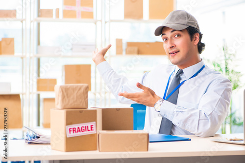 Male employee working in box delivery relocation service