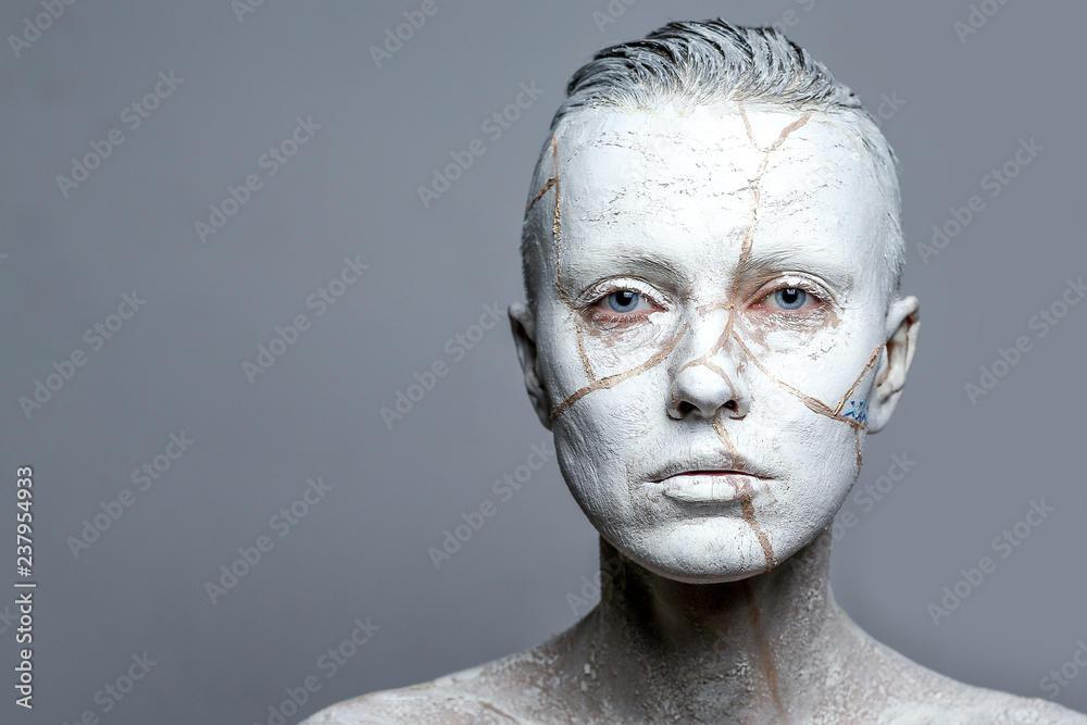 portrait of a woman covered in white clay, aging effect or pottery portrait of a woman covered in white clay, aging effect or pottery