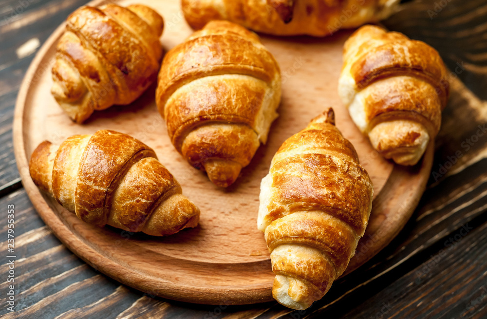 croissants on wooden background croissants on wooden background