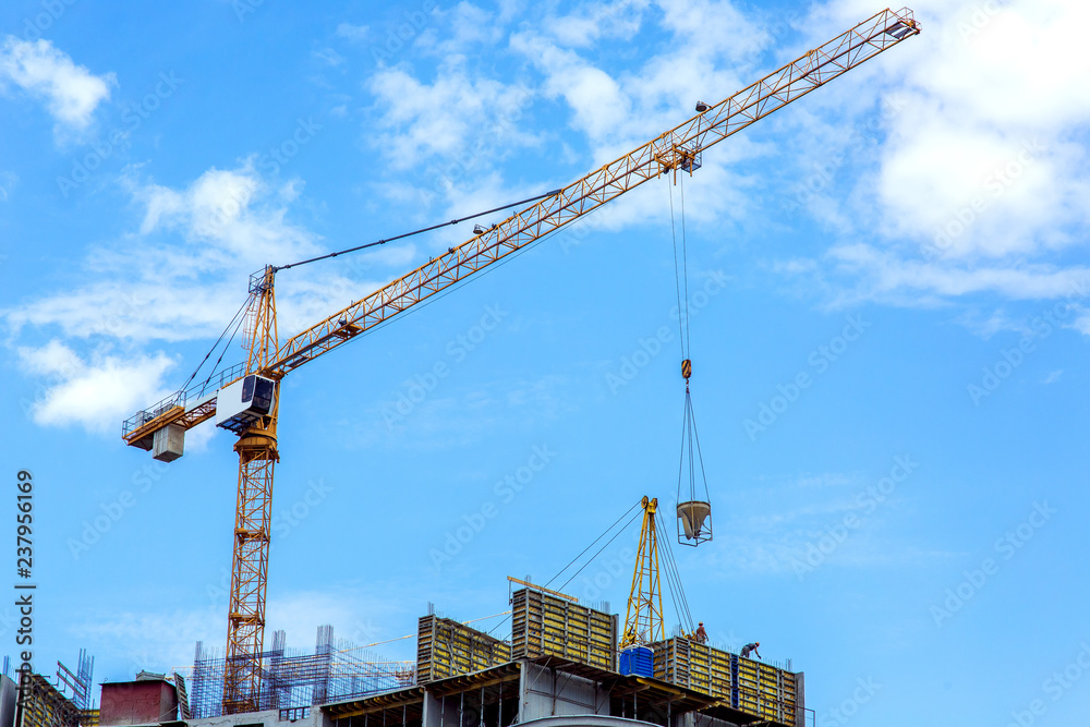 Construction of a multi-storey building with a monolithic frame construction, the process of supplying concrete for pouring walls in formwork. Construction of a multi-storey building with a monolithic frame construction, the process of supplying concrete for pouring walls in formwork.