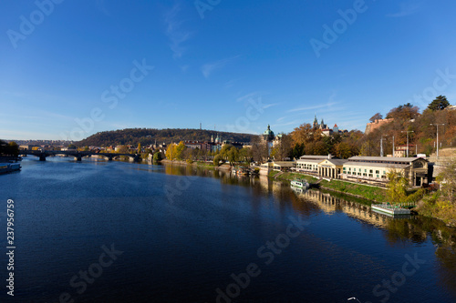 Colorful autumn Prague gothic Castle with the Lesser Town above River Vltava in the sunny Day  Czech Republic