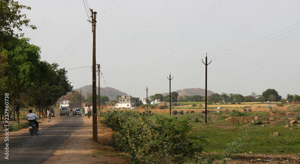 Fototapeta premium Rural street in the Indian village of Khajuraho, India