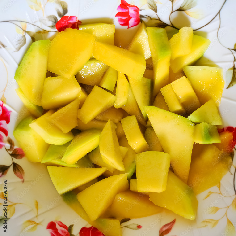 Chopped mango on a plate. Delicious tropical fruit