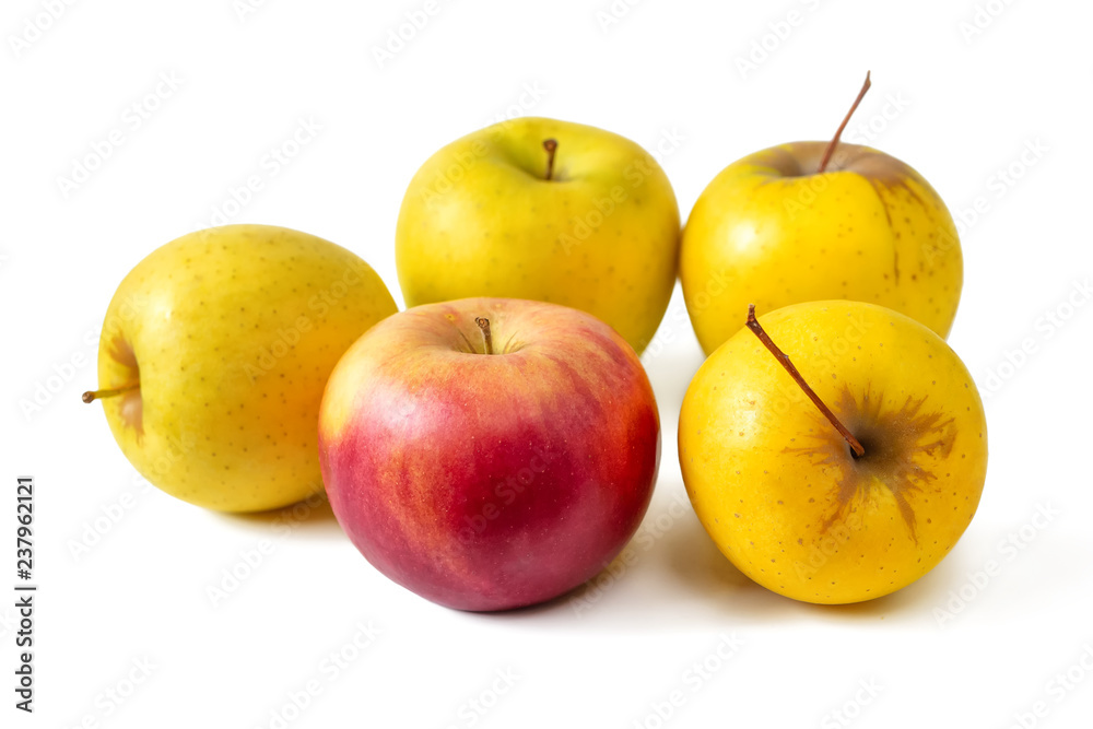 Five apples, four yellow and one red isolated on white background Five apples, four yellow and one red isolated on white background