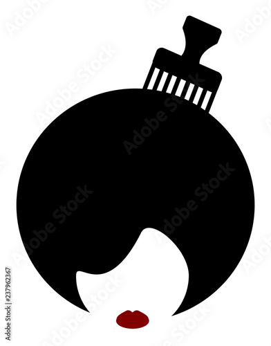 woman with afro and comb in hair