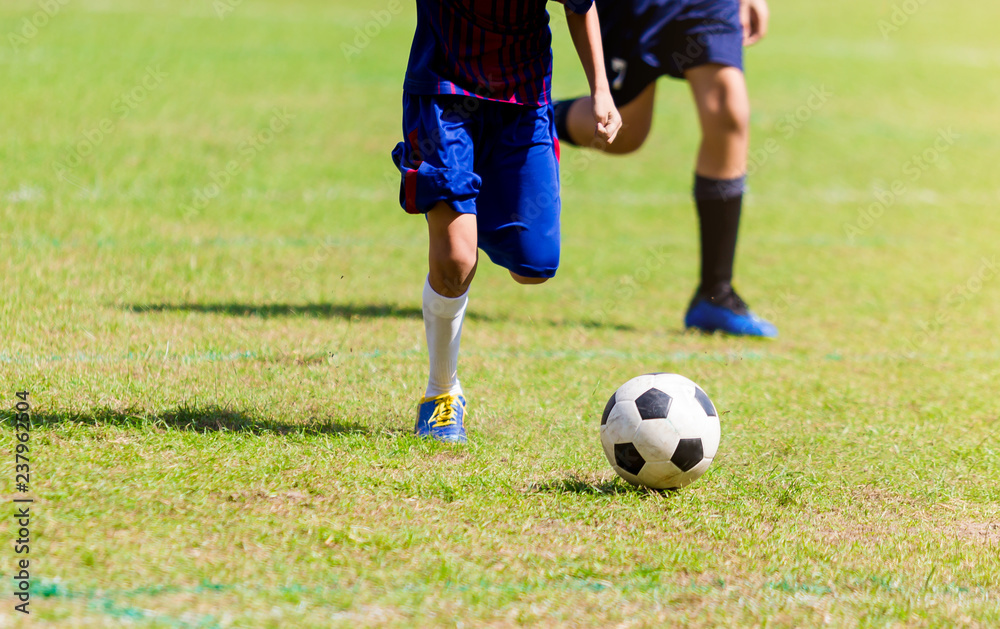 Soccer players run to trap and control the ball for shoot to goal Soccer players run to trap and control the ball for shoot to goal