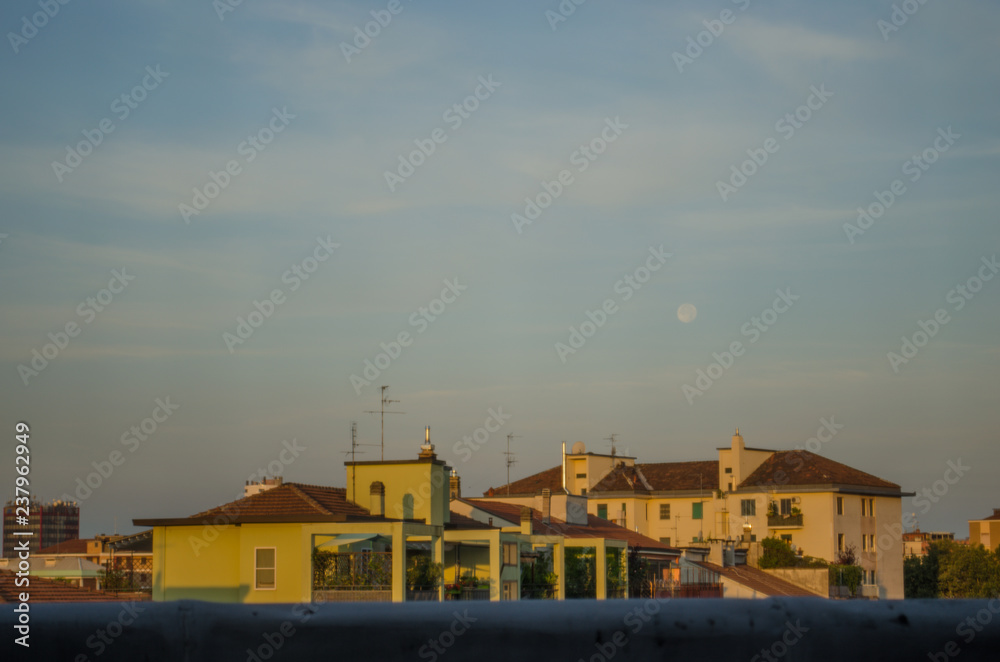 colorful city buildings in the sunrise light with copy space colorful city buildings in the sunrise light with copy space