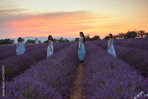 group of famales have fun in lavender flower field