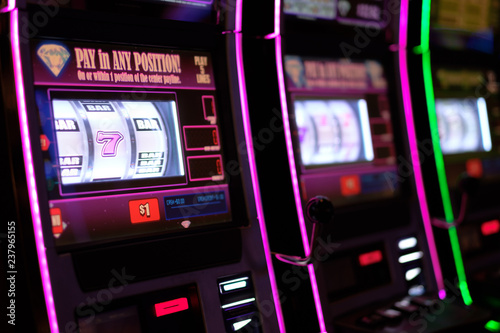 Close up of gaming slot machines in casino photo