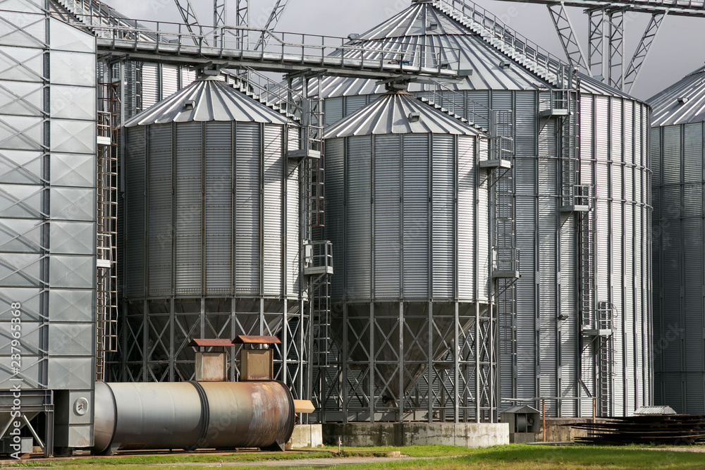 Grain Processing Building Exterior of Agricultural Silo building with storage tanks for ...