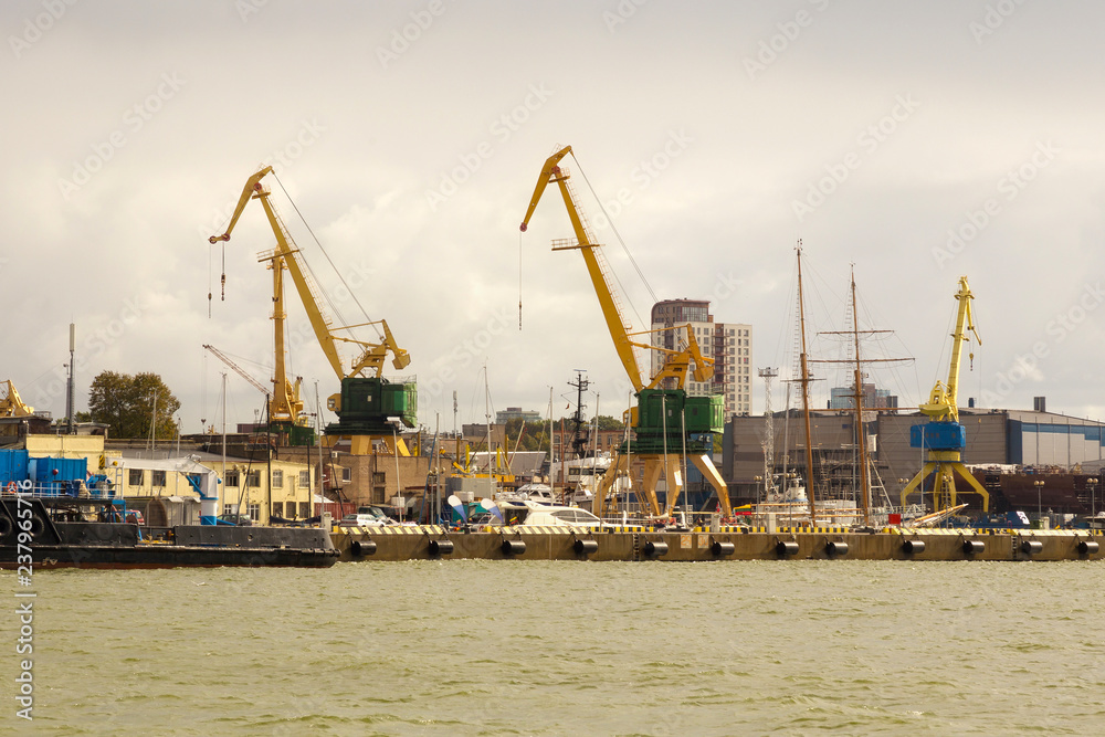 Heavy harbor jib cranes in the Klaipeda Sea Port, Lithuania.