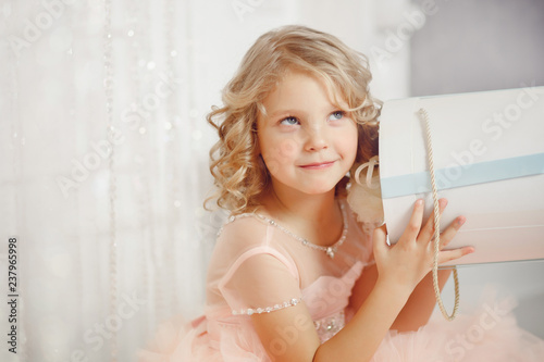 Tableau sur toile girl child in beautiful Christmas decorated