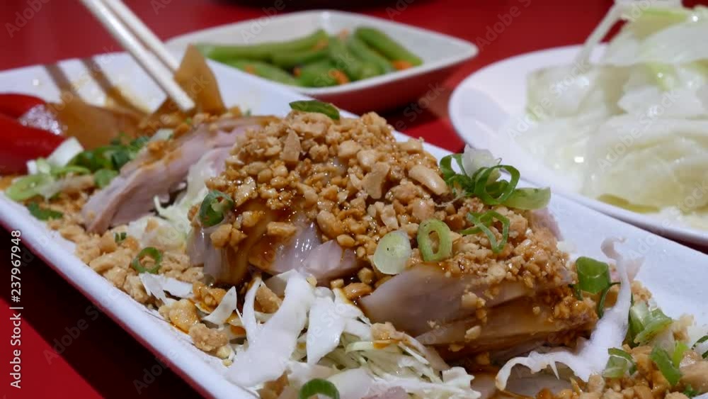 Motion of people eating appetizers on table inside Chinese restaurant with 4k resolution. Motion of people eating appetizers on table inside Chinese restaurant with 4k resolution.
