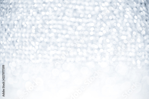 Abstract silver white lights glister bokeh background concept copy space shiny blurred lights ,Christmas Background