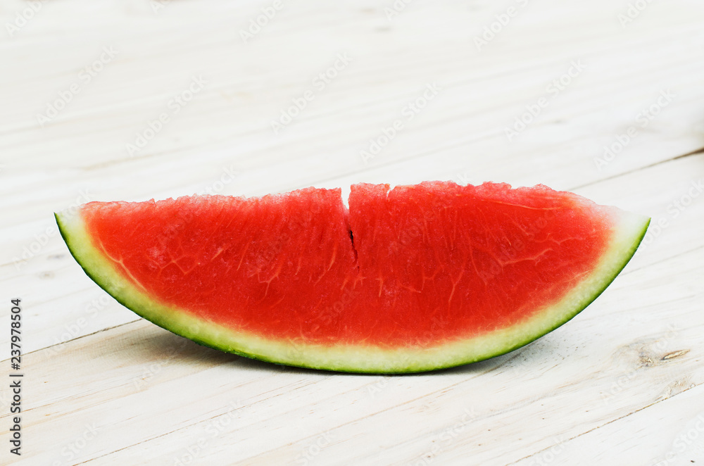 Sliced watermelon fruit on wooden table backgrounds Sliced watermelon fruit on wooden table backgrounds