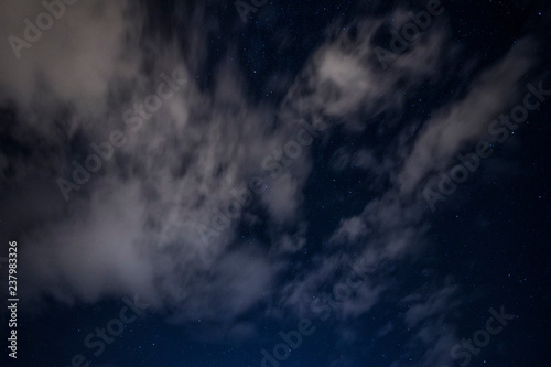 light cloud coverage over starry night covering starry night 