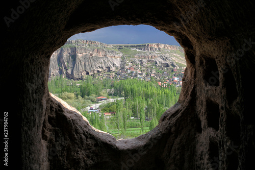View of a nearby town through a window in the Selime Monastery