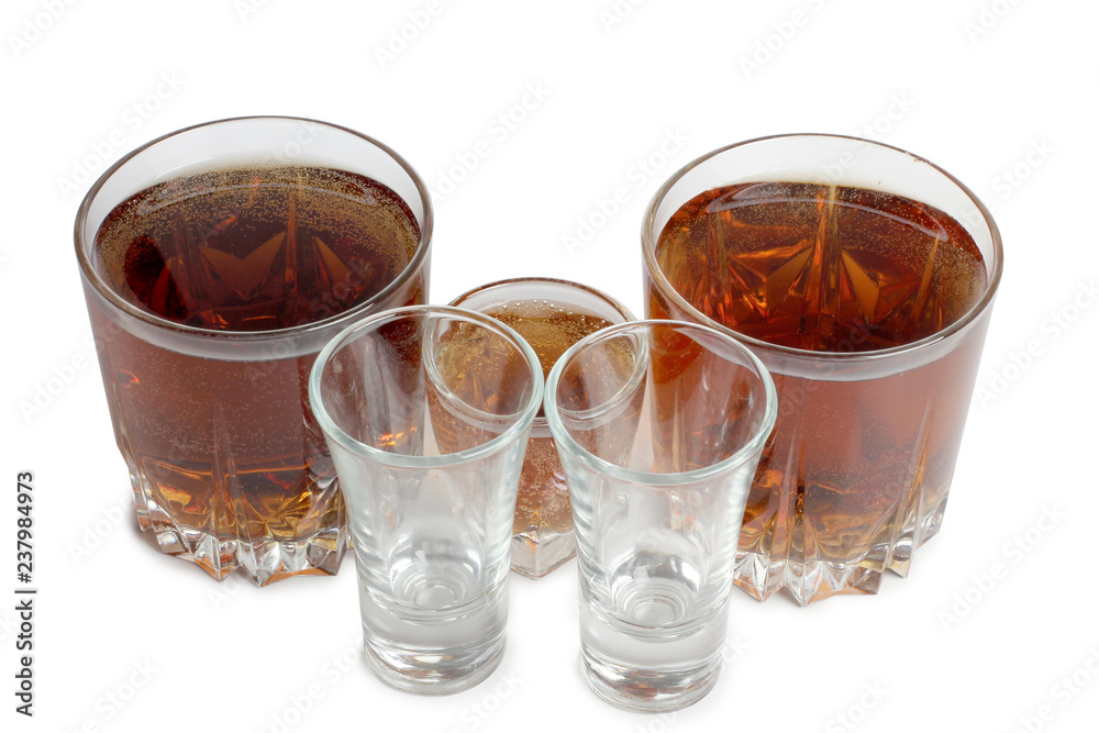 Glass jars with whiskey on white background Glass jars with whiskey on white background