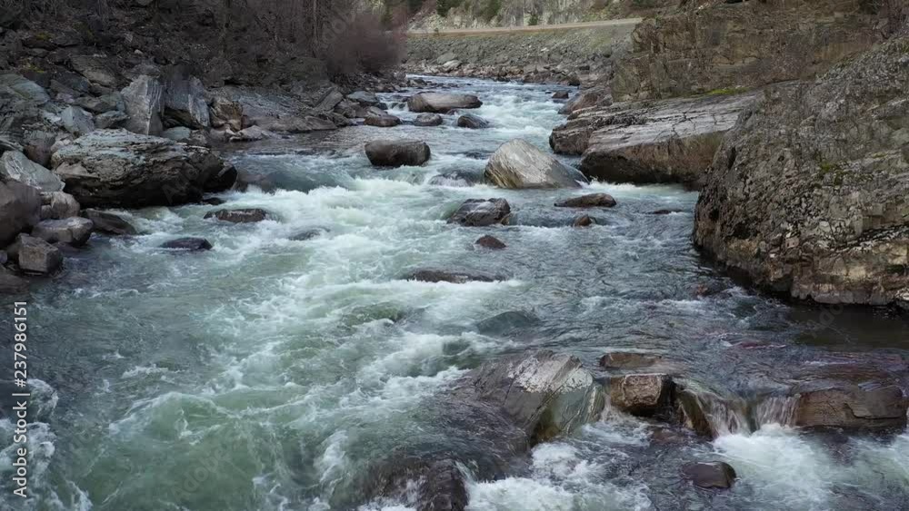 Majestic mountain river in Vancouver, Canada. Drone flying. Aerial view with mountain background. Majestic mountain river in Vancouver, Canada. Drone flying. Aerial view with mountain background.