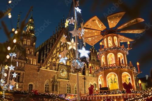 Christmas fair in the market square of Wroclaw, Poland. The city hall and wind mill.