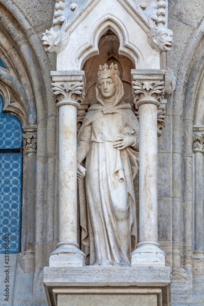 Woman statue at the fasade Mathias church in the castle district, Budapest, Hungary