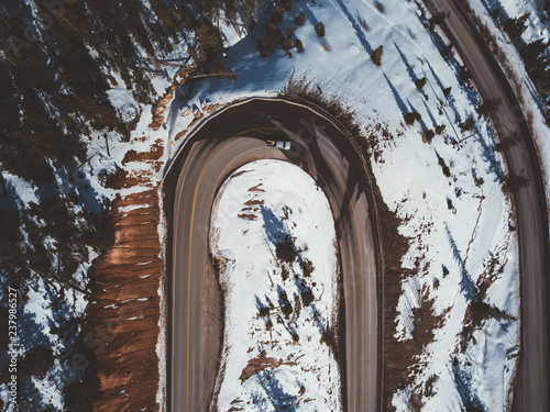 hairpin turn on a snowy serpentine road photo