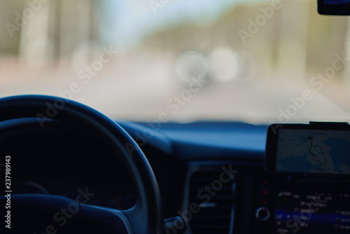 Safe and rational driving, using the smartphone navigator. © Artem