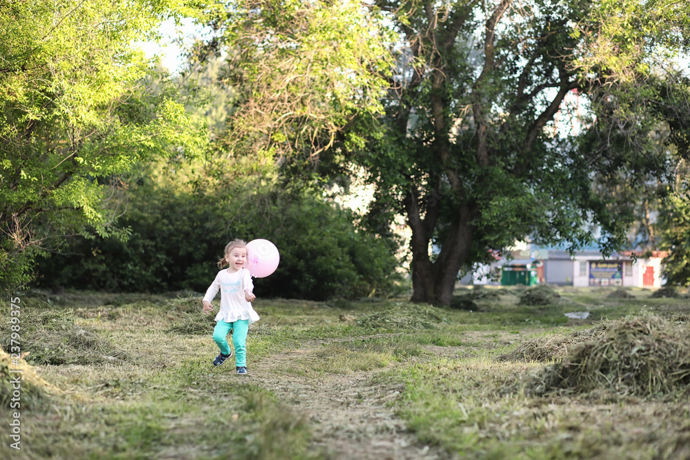 Little children are walking in a park