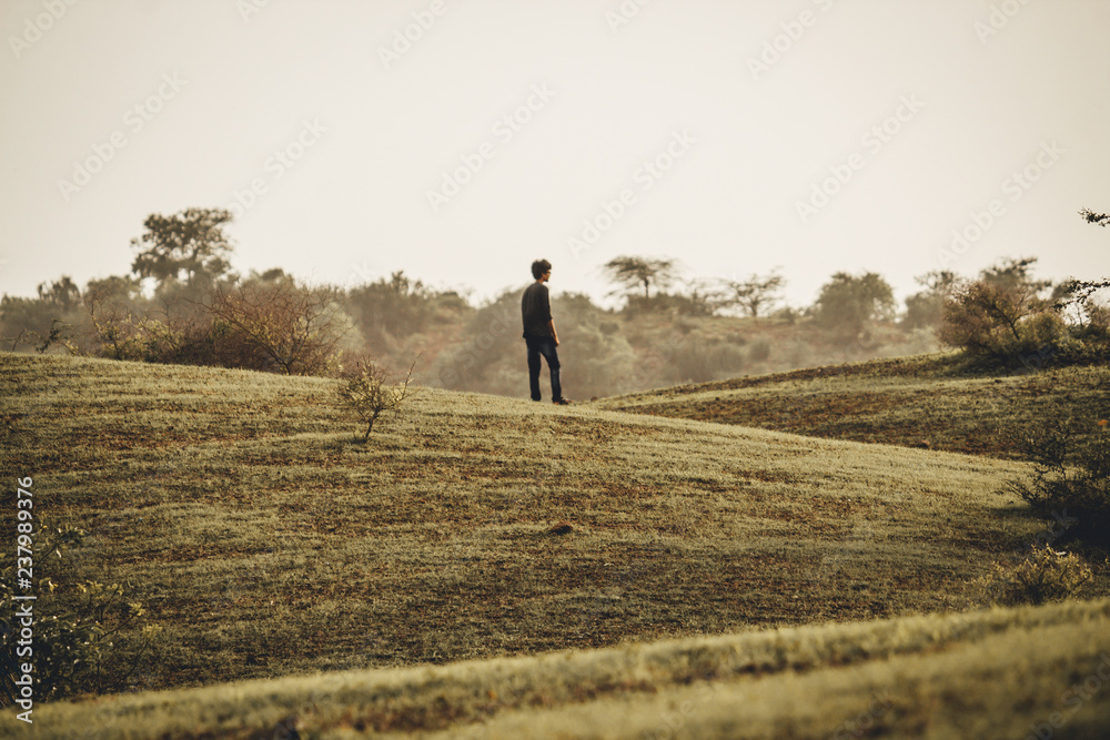 Fototapeta premium Man in front of the hill